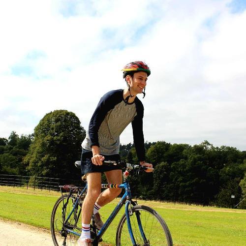 A smiling cyclist at Newton Park campus