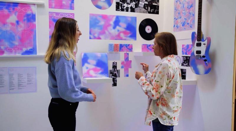Two people looking at a marketing presentation