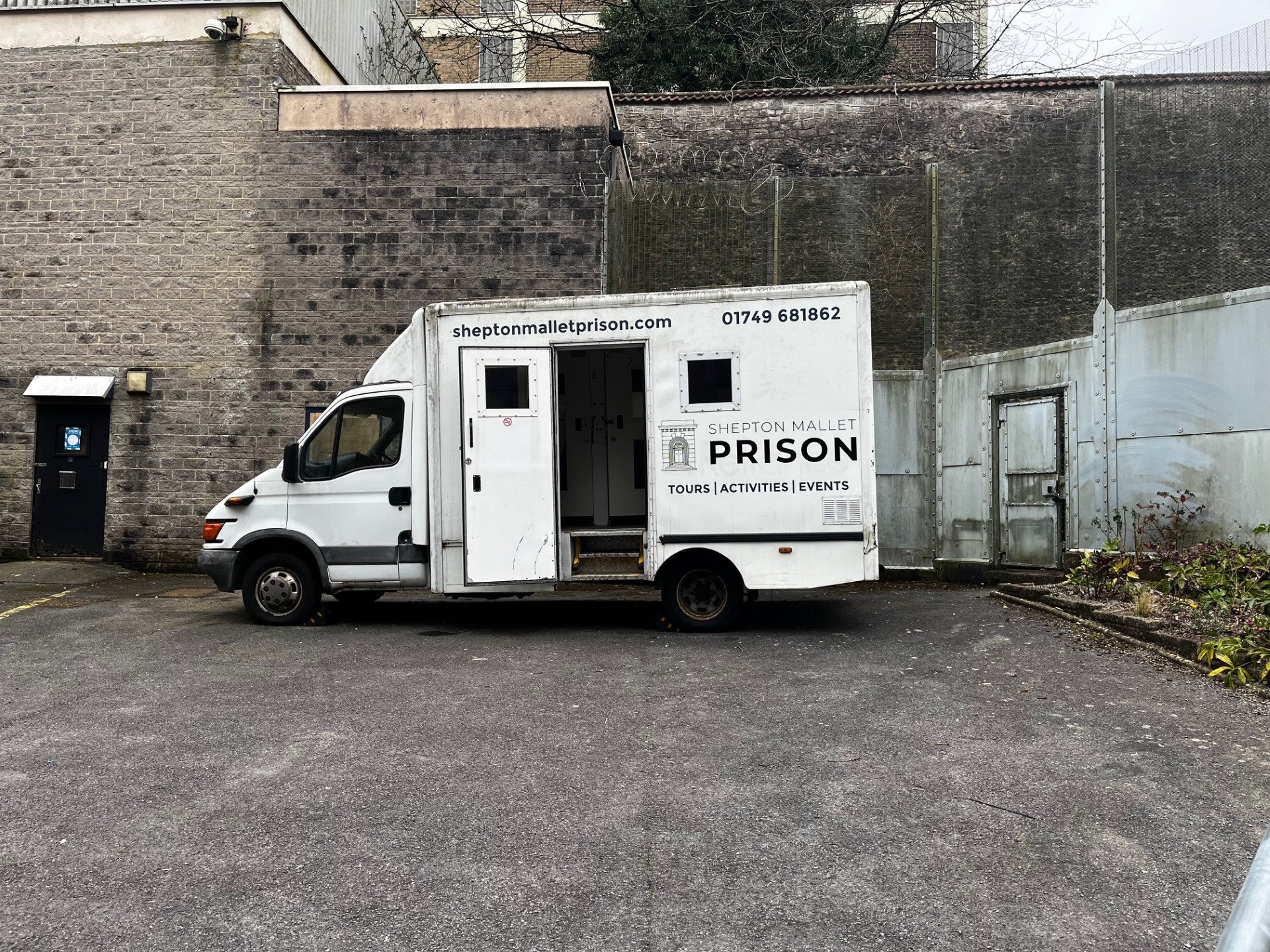 A prison vehicle parked outside a disused prison