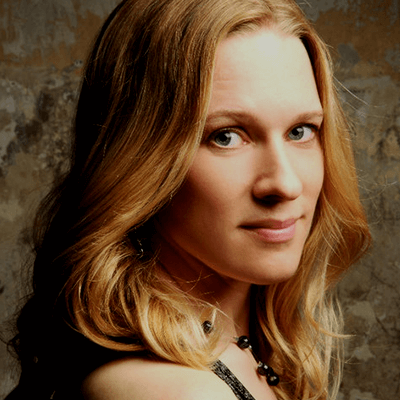 Helen Reid's profile photo. She is stood smiling at the camera
